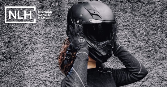 motorcycle rider removing their helmet